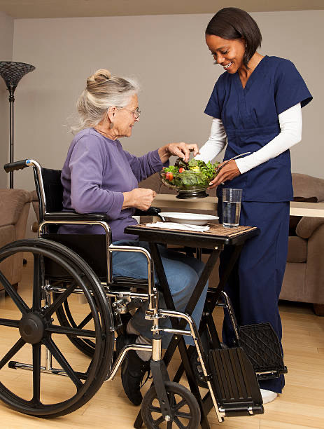 Caregiver preparing a healthy meal in a senior client’s kitchen in Maitland, Central Florida